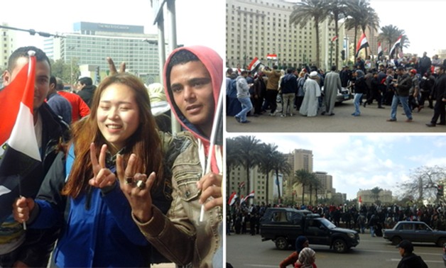 "الثورة بتتكلم صينى".. مواطنون يلتقطون صورًا مع فتاة صينية تحمل علم مصر‎ بـ"التحرير"