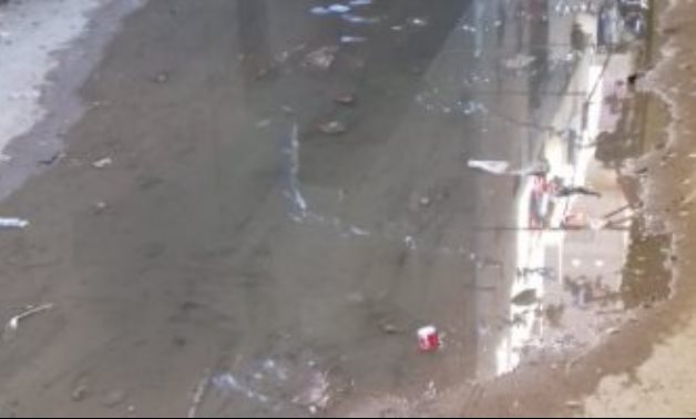 شكوى من طفح مياه الصرف فى شارع عمر بن الخطاب بفيصل