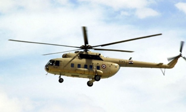طائرة هليكوبتر تحلق فى سماء "وسط البلد" لتأمين احتفالات عيد تحرير سيناء